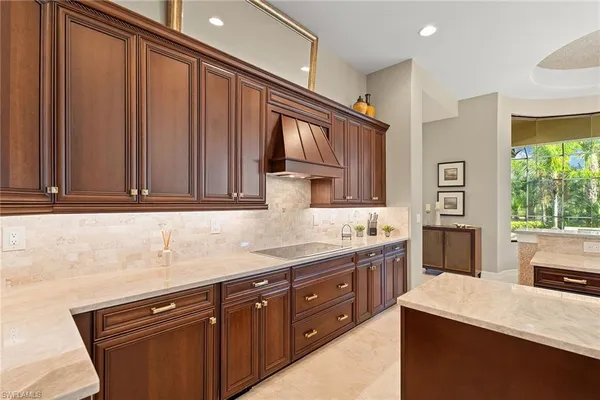 a kitchen with stainless steel appliances granite countertop a sink stove and cabinets