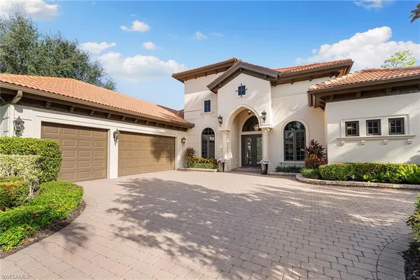 a view of a white house with a outdoor space
