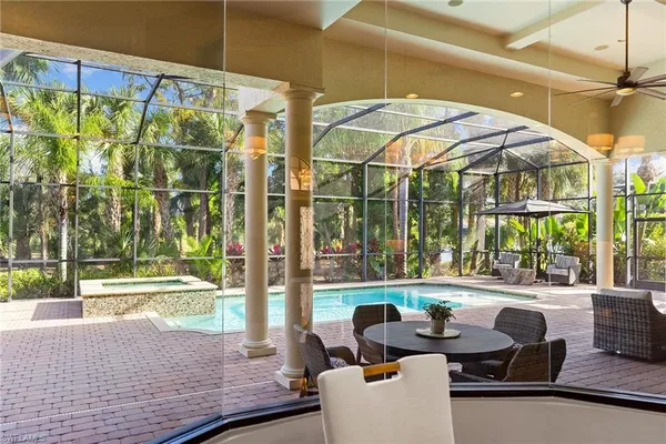 a outdoor space with patio the couches and pool table and chairs