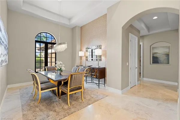 a dining room with furniture and window