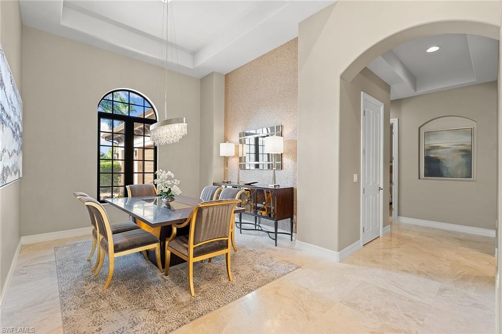 7400 Byrons Way Naples, FL 34113 - Photo 22 of 50 a dining room with furniture and window