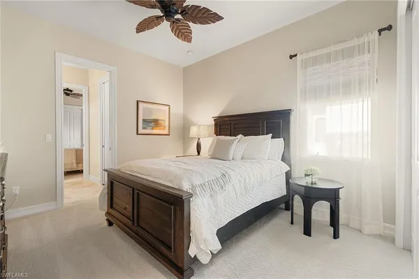 a bedroom with a bed and a table