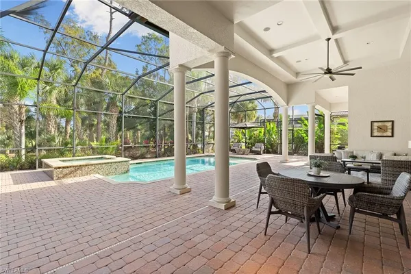 a view of a patio with table and chairs and wooden floor