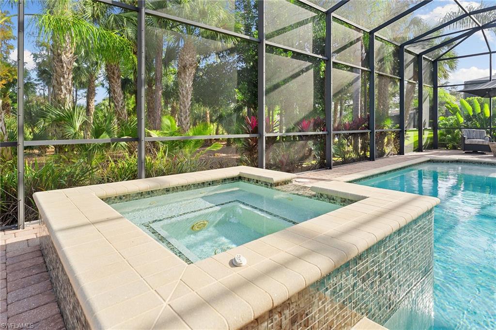 7400 Byrons Way Naples, FL 34113 - Photo 41 of 50 a view of a swimming pool with a patio