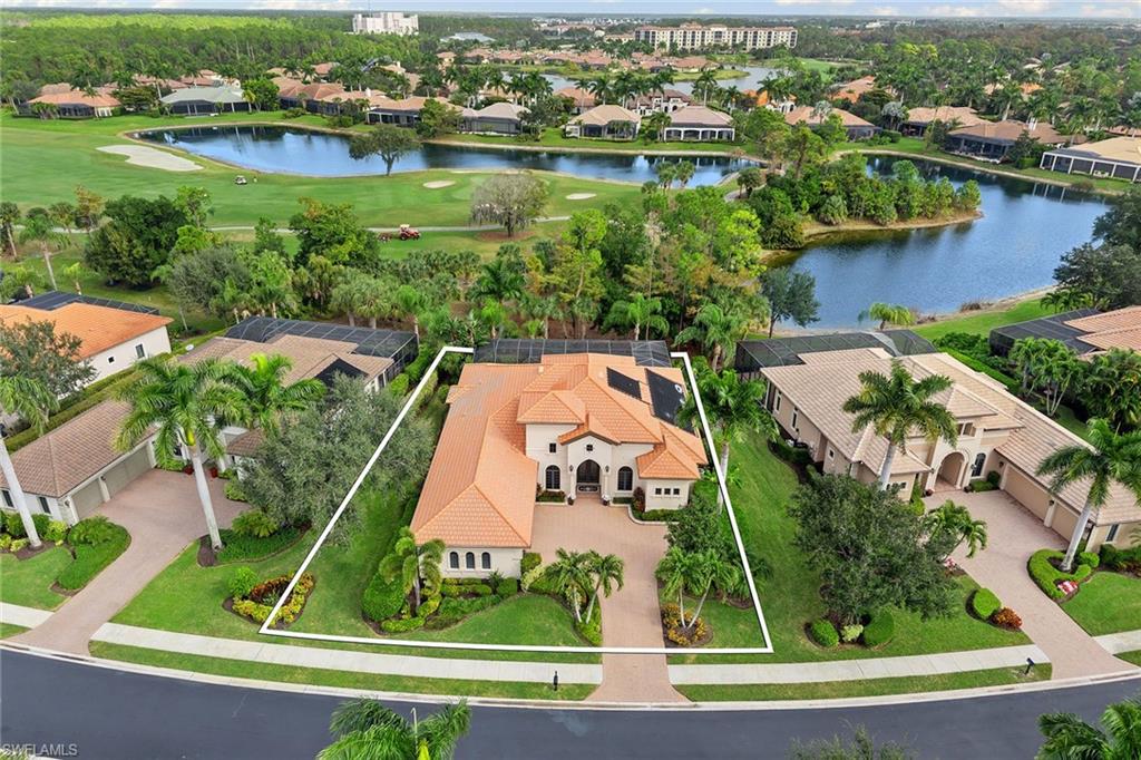 7400 Byrons Way Naples, FL 34113 - Photo 47 of 50 an aerial view of house with yard lake and ocean view