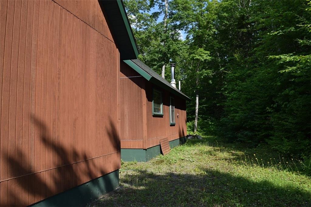 85 Gardner Point Road Mount Chase, ME 04765 - Photo 25 of 35 Back side of home & garage, drilled...