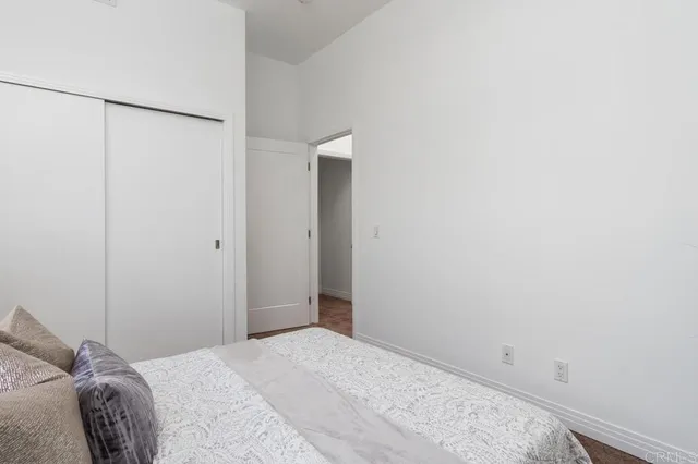 a bedroom with a bed and a shower