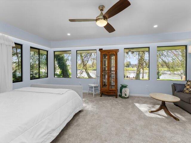 195 Howell Avenue Red Bluff, CA 96080 - Photo 18 of 66 a spacious bedroom with a bed a table and chair