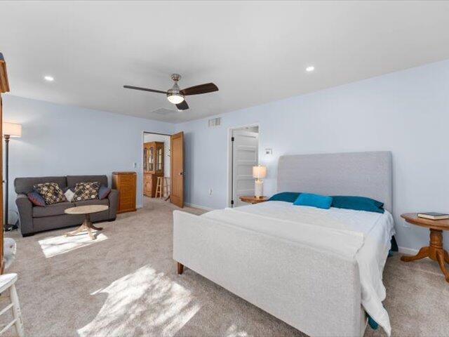 195 Howell Avenue Red Bluff, CA 96080 - Photo 19 of 66 a bedroom with a bed and a chandelier