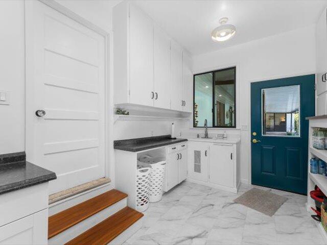 195 Howell Avenue Red Bluff, CA 96080 - Photo 28 of 66 a kitchen with granite countertop cabinets and sink