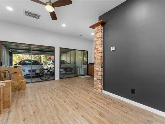 195 Howell Avenue Red Bluff, CA 96080 - Photo 30 of 66 an empty room with wooden floor and windows