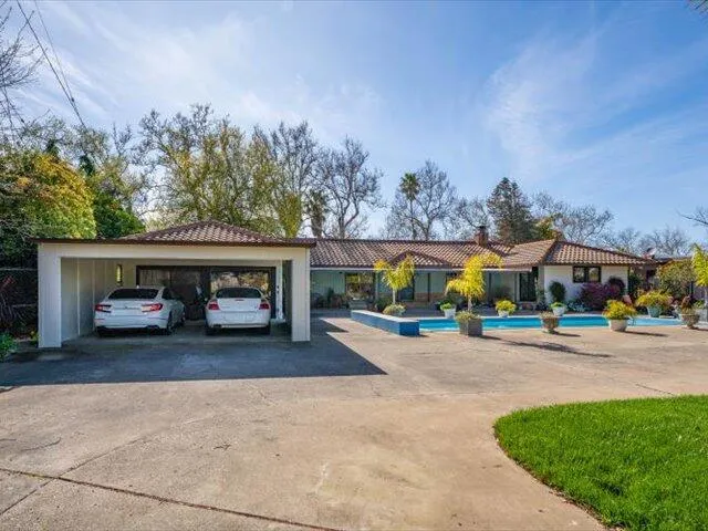 a view of a car parked in front of a house