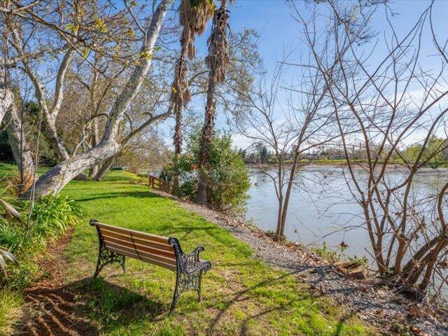 195 Howell Avenue Red Bluff, CA 96080 - Photo 41 of 66 a green bench sitting in the middle of a yard