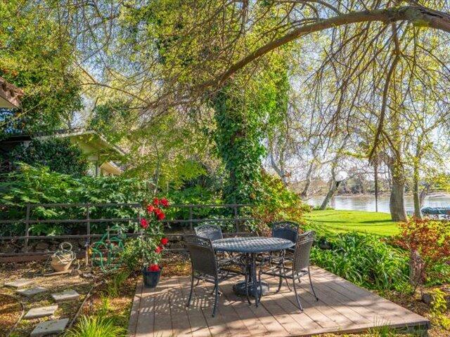 195 Howell Avenue Red Bluff, CA 96080 - Photo 6 of 66 a backyard with table and chairs and potted plants