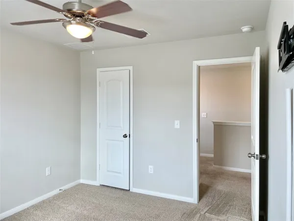 a view of an empty room with a bathroom