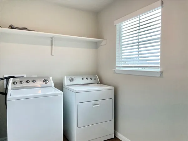 a utility room with dryer and washer