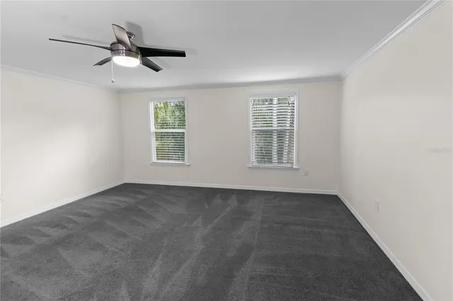 a view of a backyard with a swimming pool