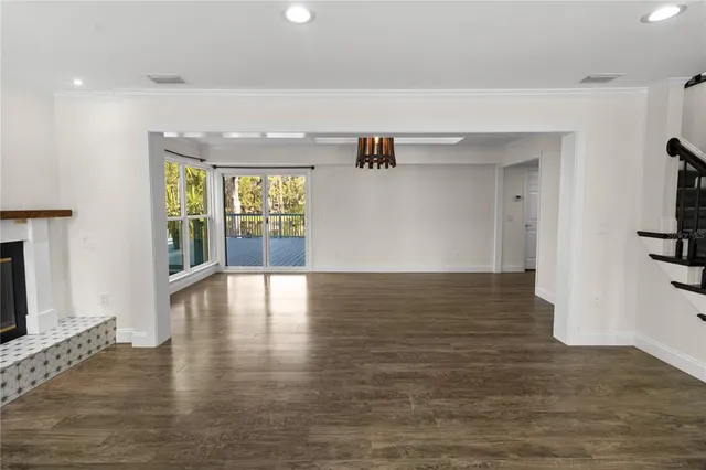 a view of an entryway with wooden floor