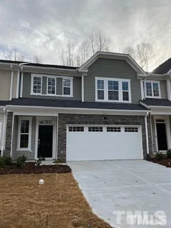 a front view of a house with yard