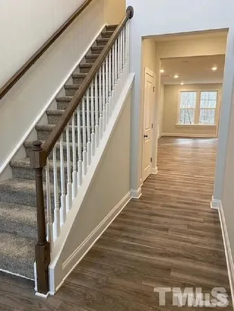 a view of staircase with wooden floor and staircase
