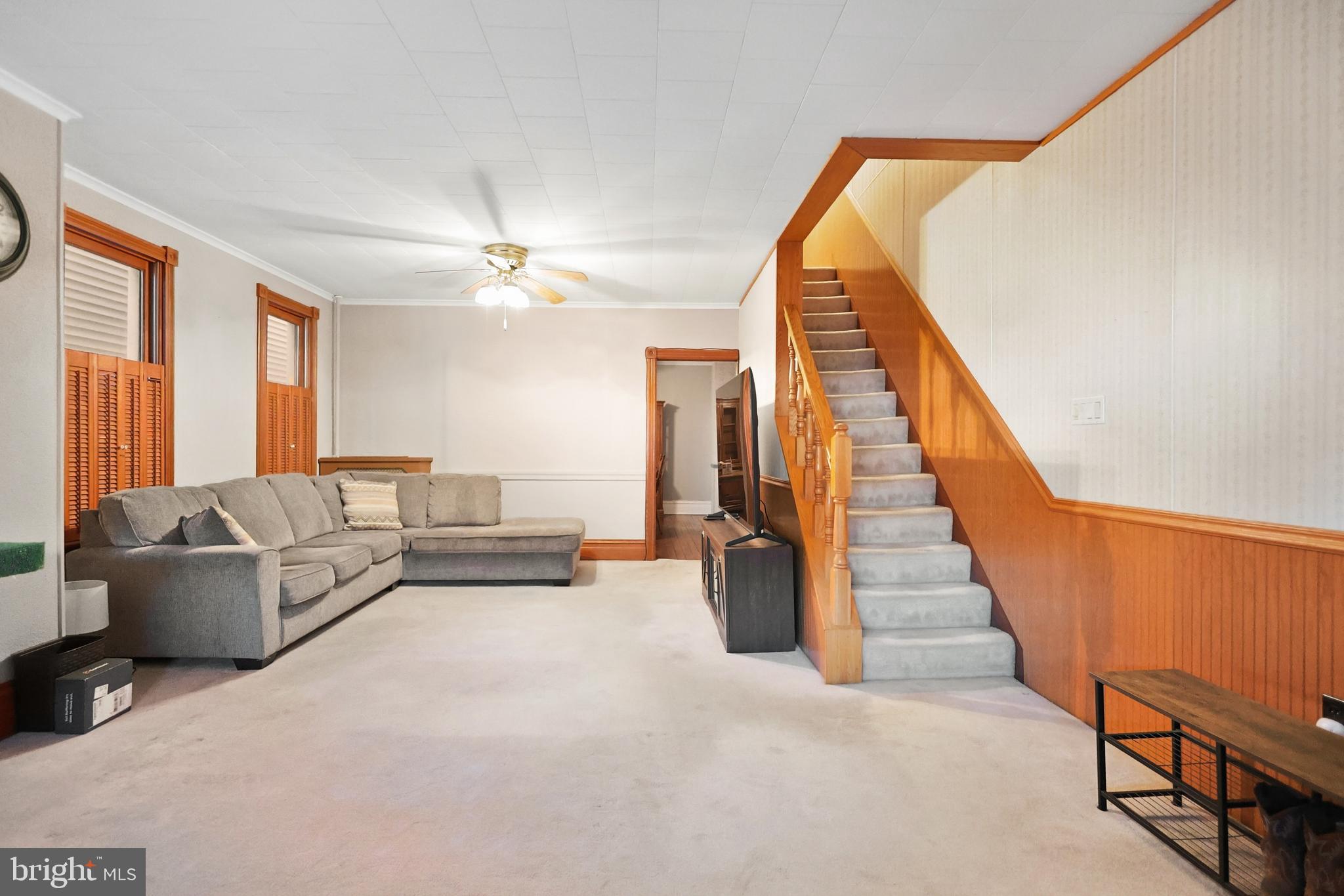 728 East Broad Street Tamaqua, PA 18252 - Photo 13 of 26 a living room with furniture and a chandelier