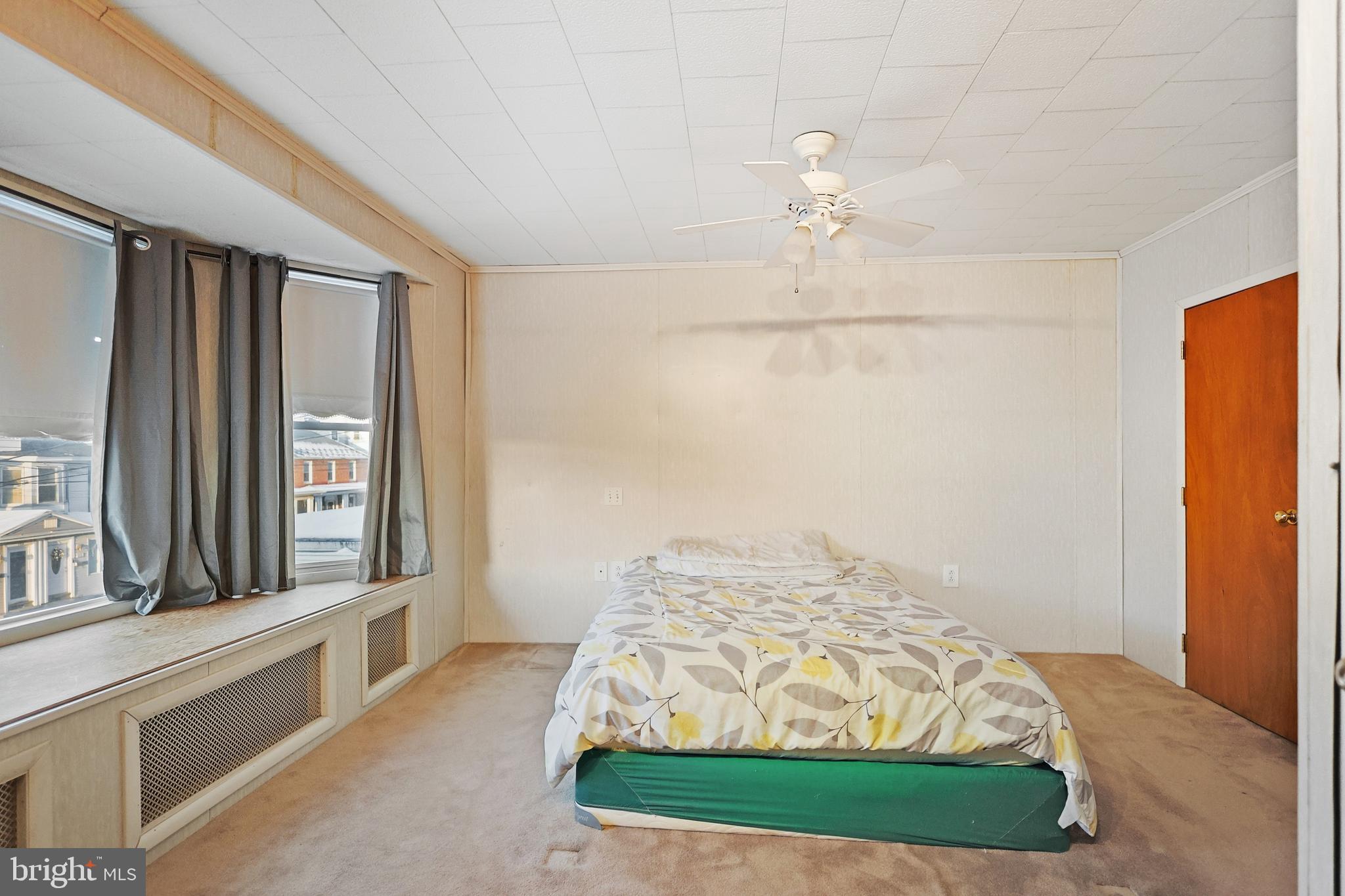 728 East Broad Street Tamaqua, PA 18252 - Photo 19 of 26 a bedroom with a bed and a large window