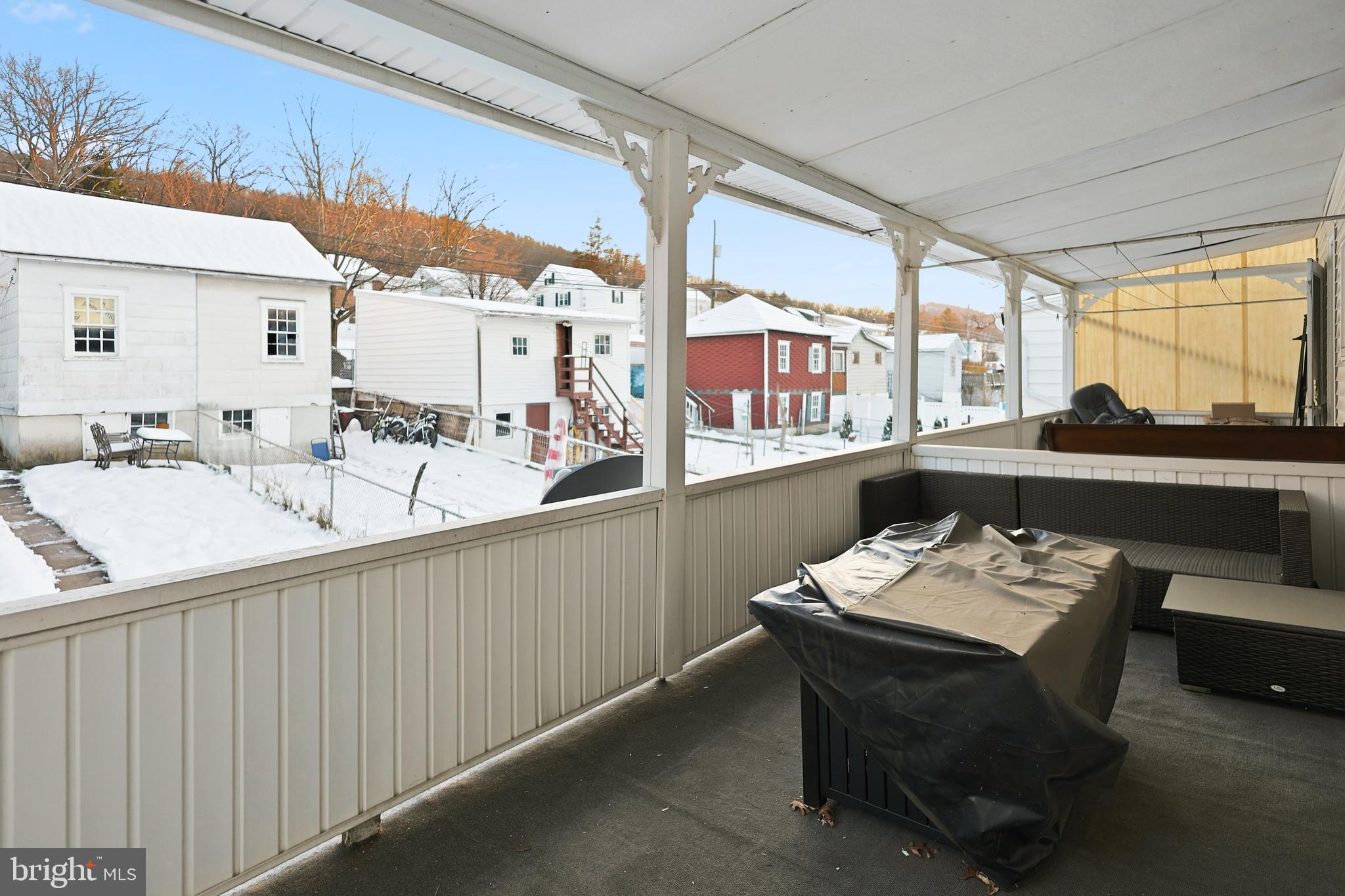 728 East Broad Street Tamaqua, PA 18252 - Photo 21 of 26 a room with furniture a large window and a table