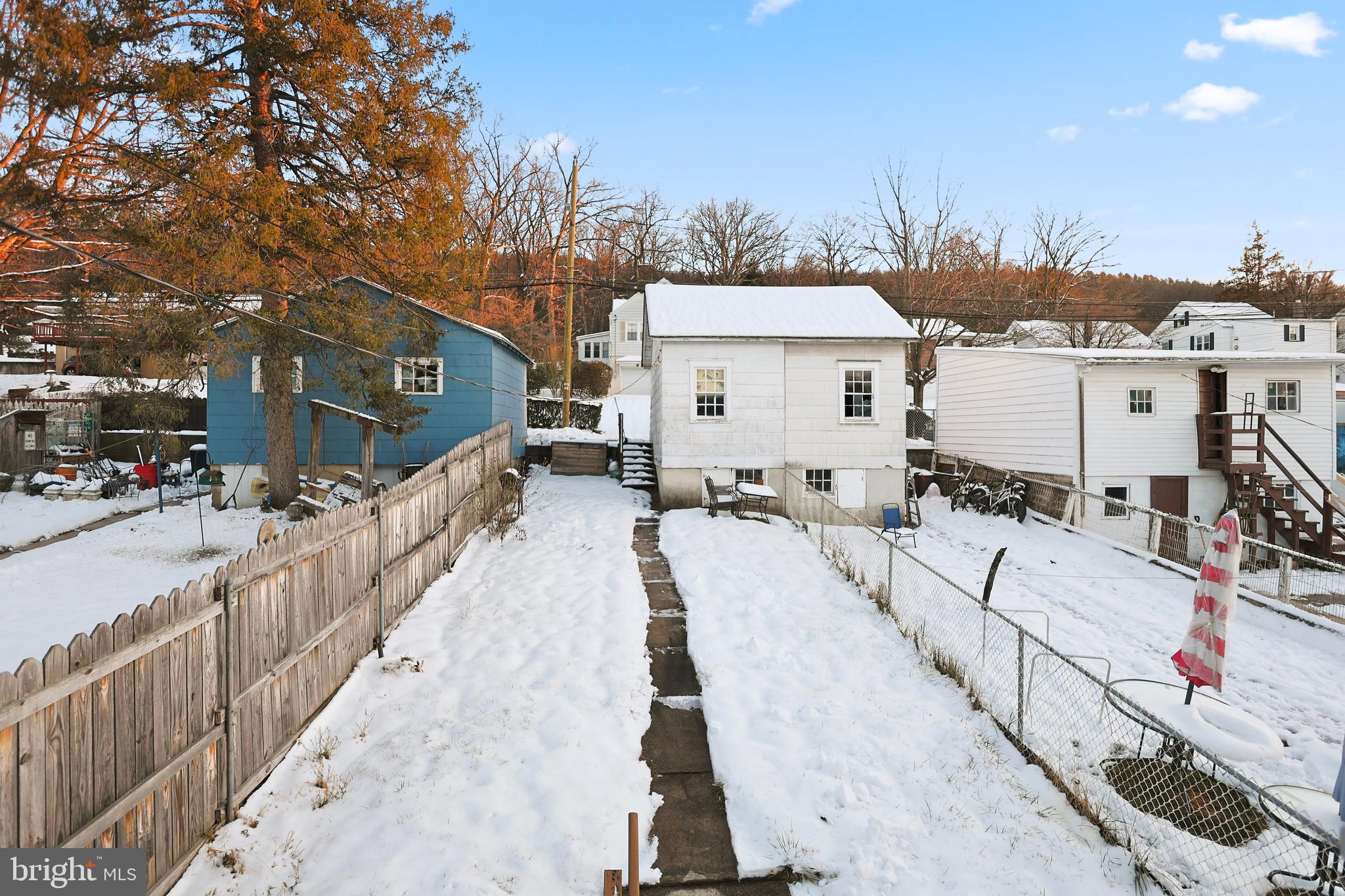 728 East Broad Street Tamaqua, PA 18252 - Photo 22 of 26 a view of a house with wooden fence