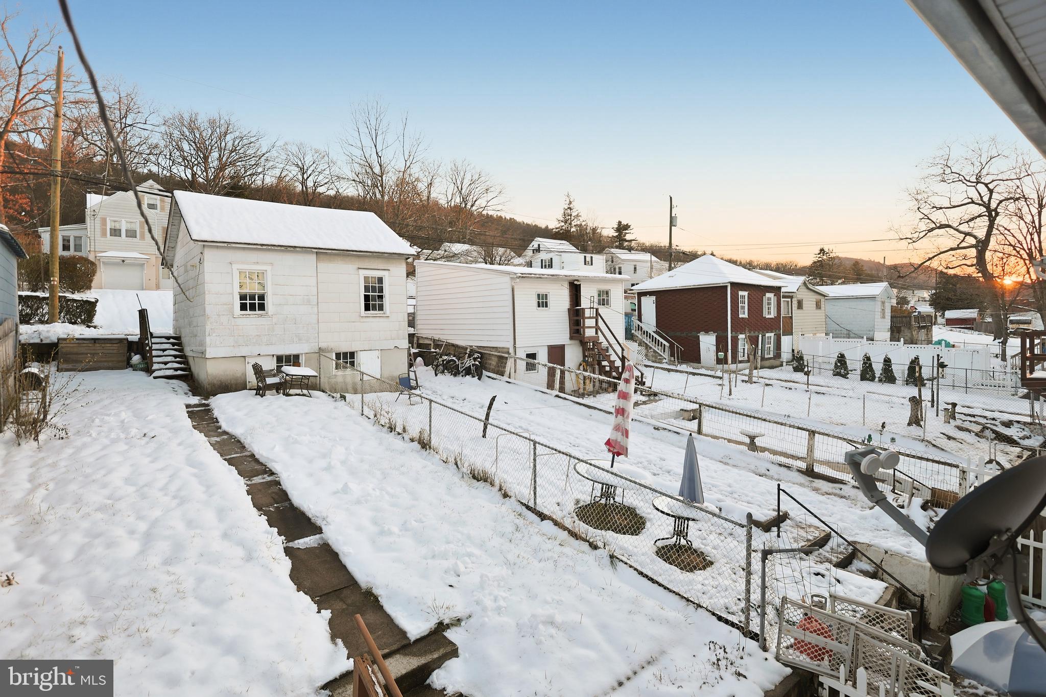 728 East Broad Street Tamaqua, PA 18252 - Photo 23 of 26 a view of a white house with wooden fence