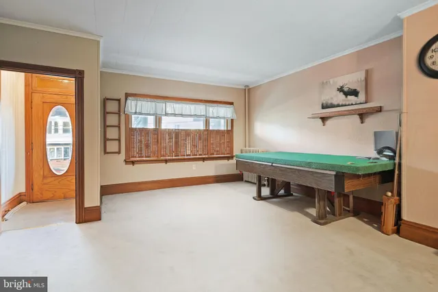 a room with air conditioner duct and windows