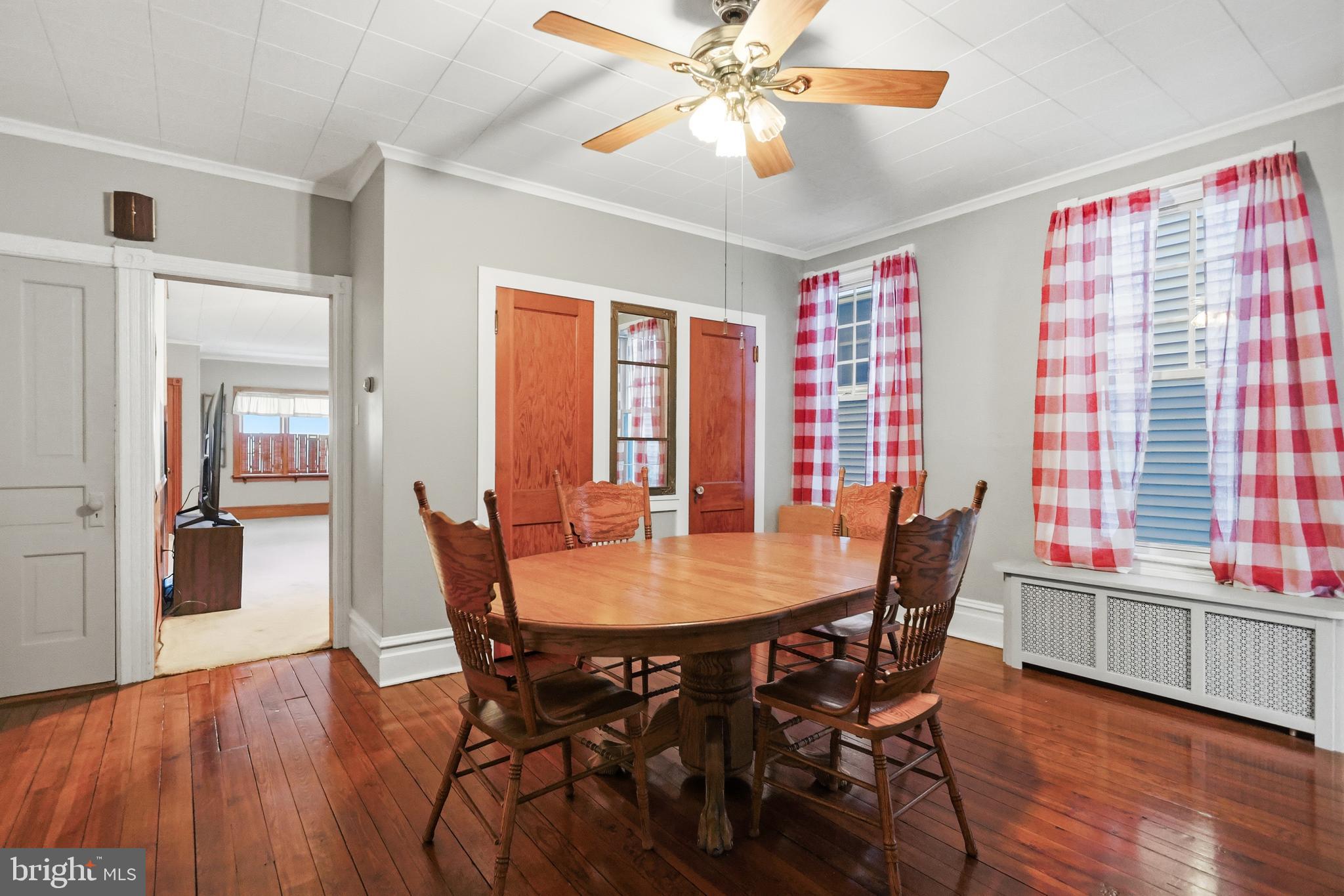 728 East Broad Street Tamaqua, PA 18252 - Photo 7 of 26 a view of a dining room with furniture and wooden floor