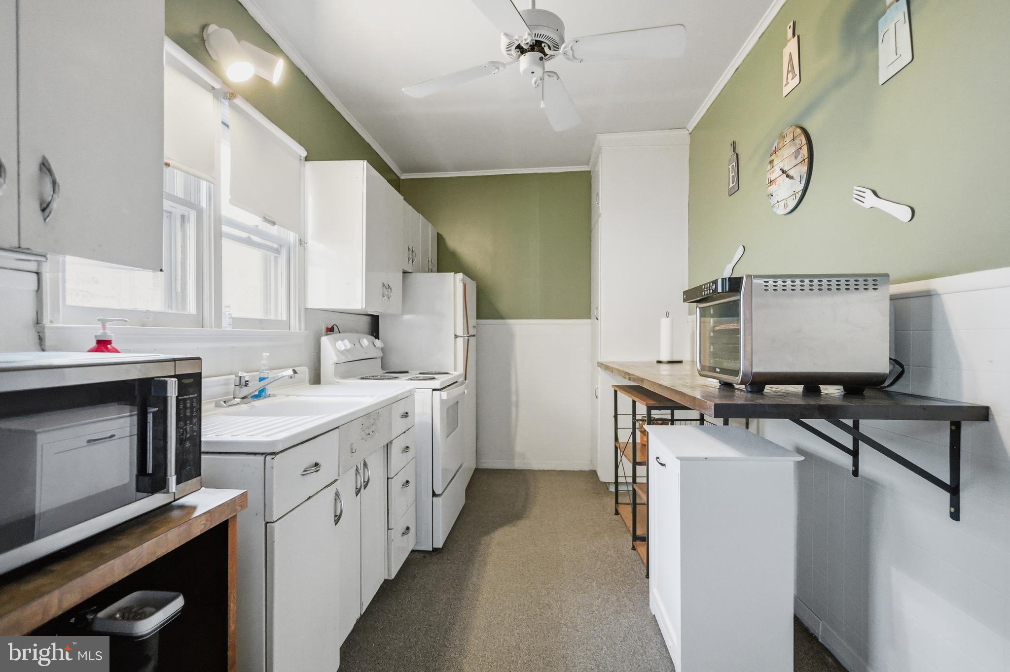 728 East Broad Street Tamaqua, PA 18252 - Photo 10 of 26 a kitchen with stainless steel appliances a sink stove and cabinets