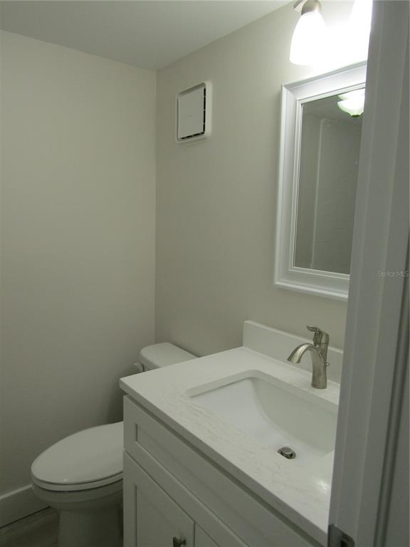 999 Inlet Circle, Unit D101 Venice, FL 34285 - Photo 12 of 29 a bathroom with a sink and toilet