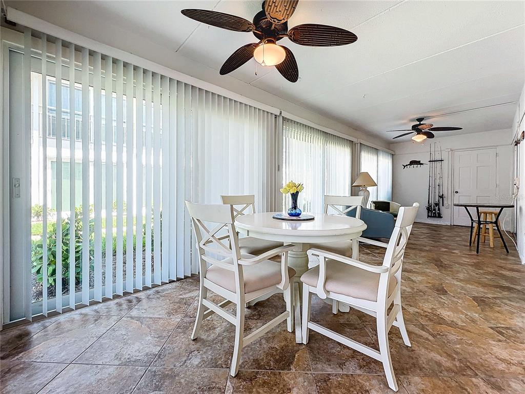 999 Inlet Circle, Unit D101 Venice, FL 34285 - Photo 21 of 29 a view of a dining room with furniture window and outside view