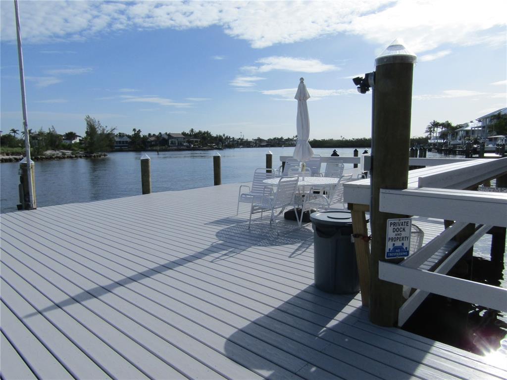 999 Inlet Circle, Unit D101 Venice, FL 34285 - Photo 24 of 29 a wooden floor with view of lake
