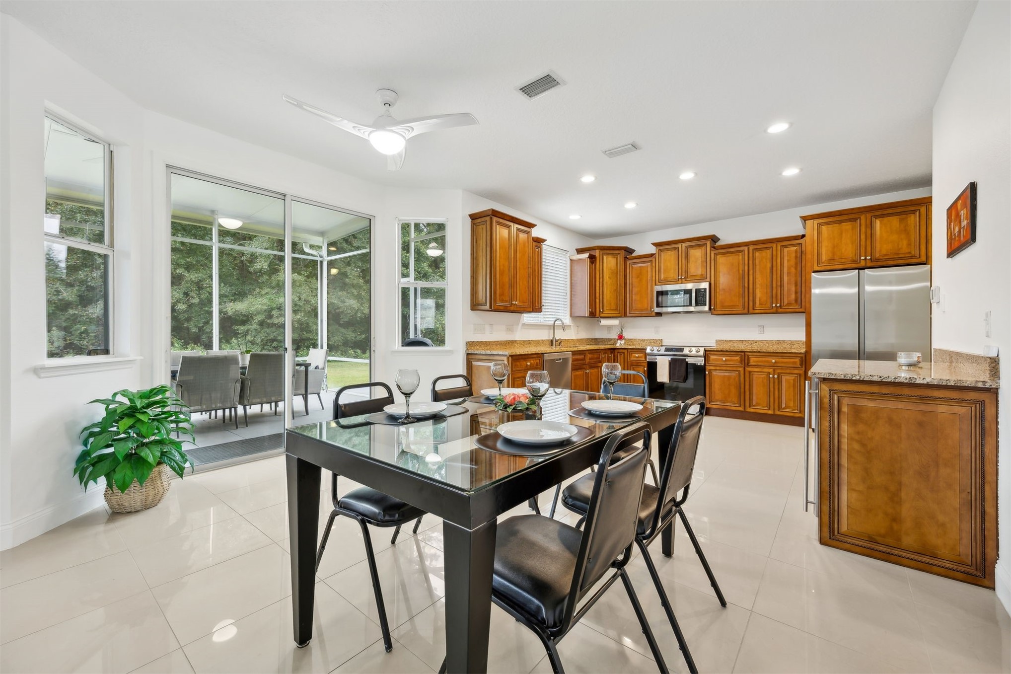 76002 Tideview Lane Yulee, FL 32097 - Photo 12 of 58 a view of a dining room with furniture window and outside view