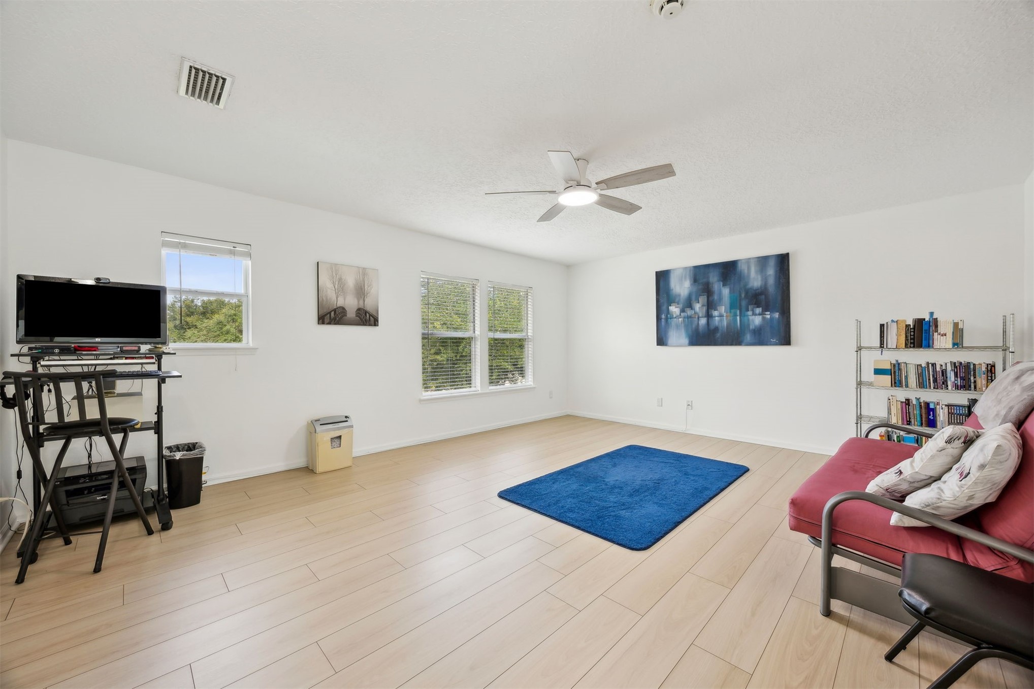 76002 Tideview Lane Yulee, FL 32097 - Photo 21 of 58 a living room with furniture and a flat screen tv