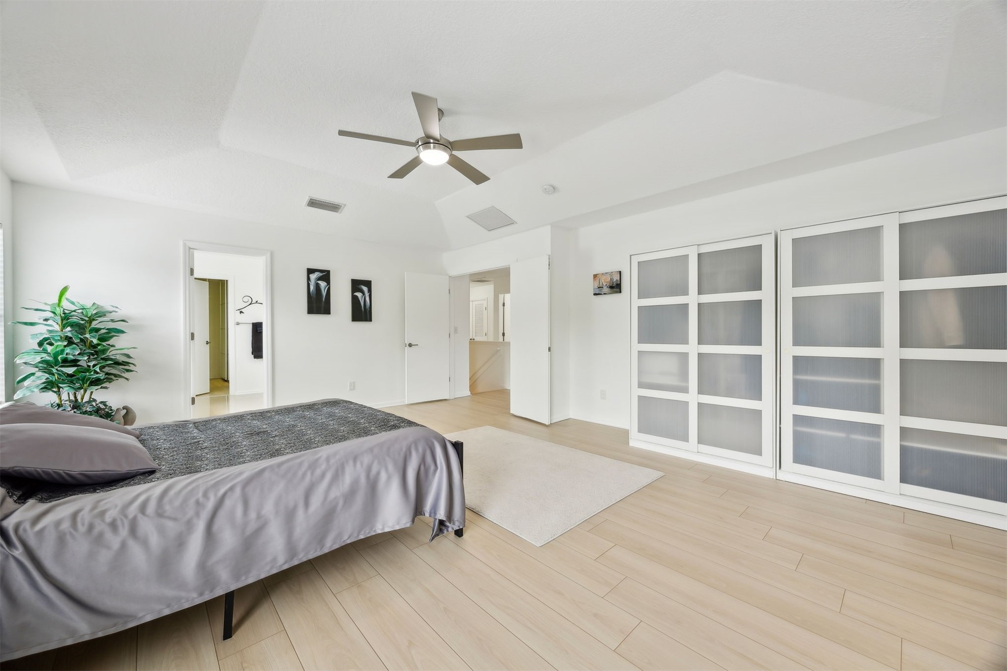 76002 Tideview Lane Yulee, FL 32097 - Photo 23 of 58 a spacious bedroom with a bed and a window
