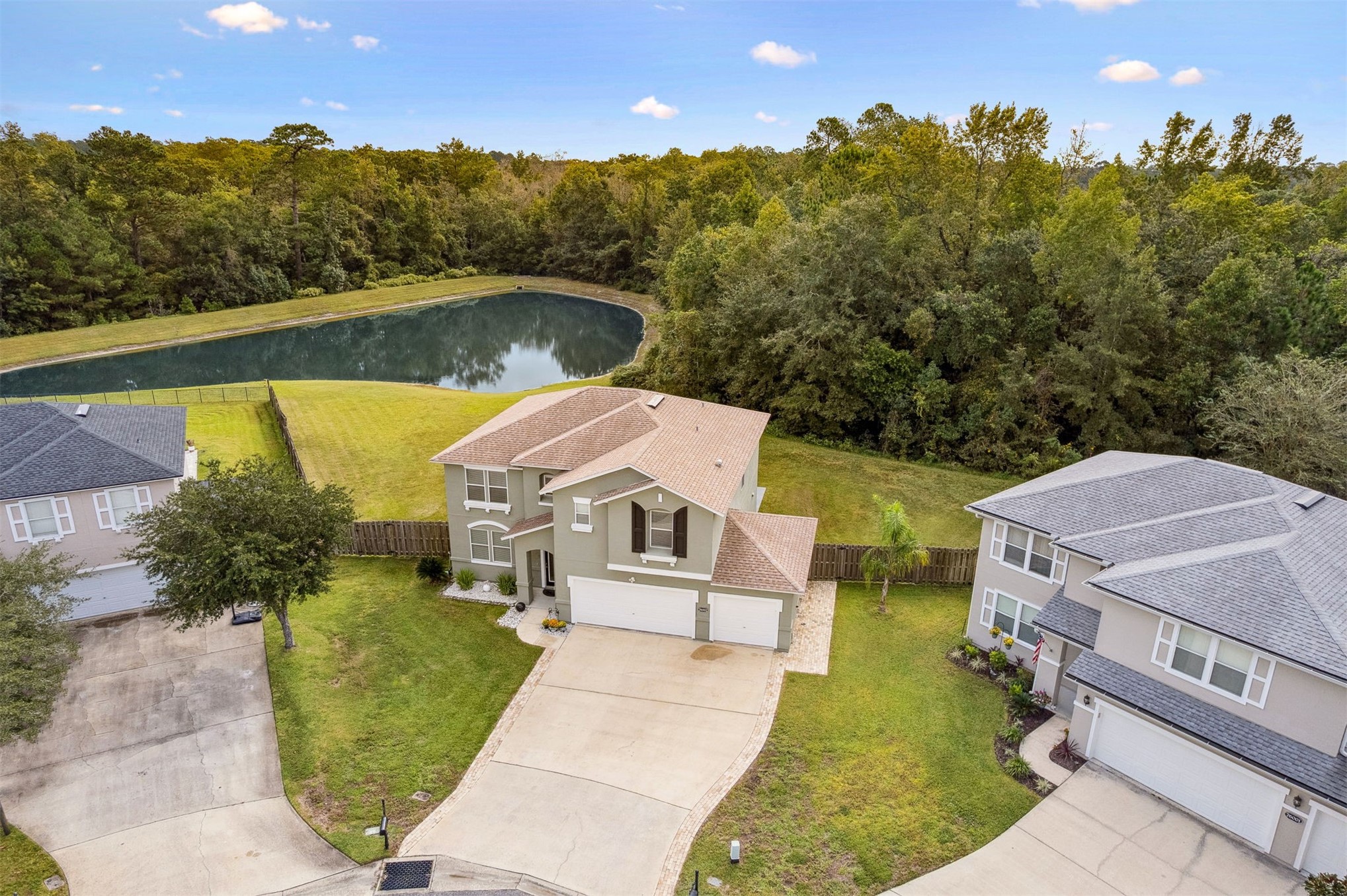 76002 Tideview Lane Yulee, FL 32097 - Photo 3 of 58 an aerial view of a house with swimming pool and garden