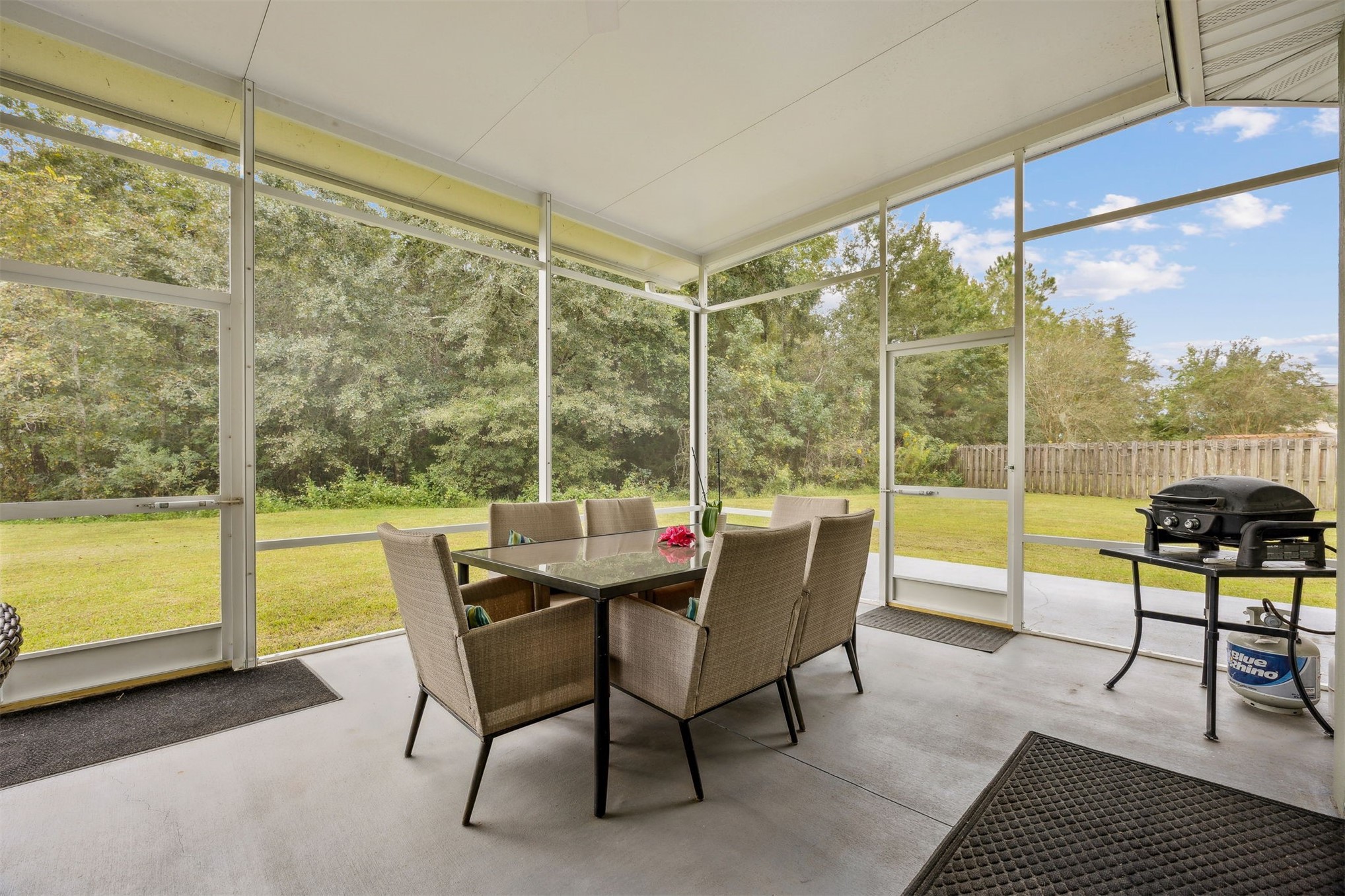 76002 Tideview Lane Yulee, FL 32097 - Photo 38 of 58 a dining room with furniture and a floor to ceiling window