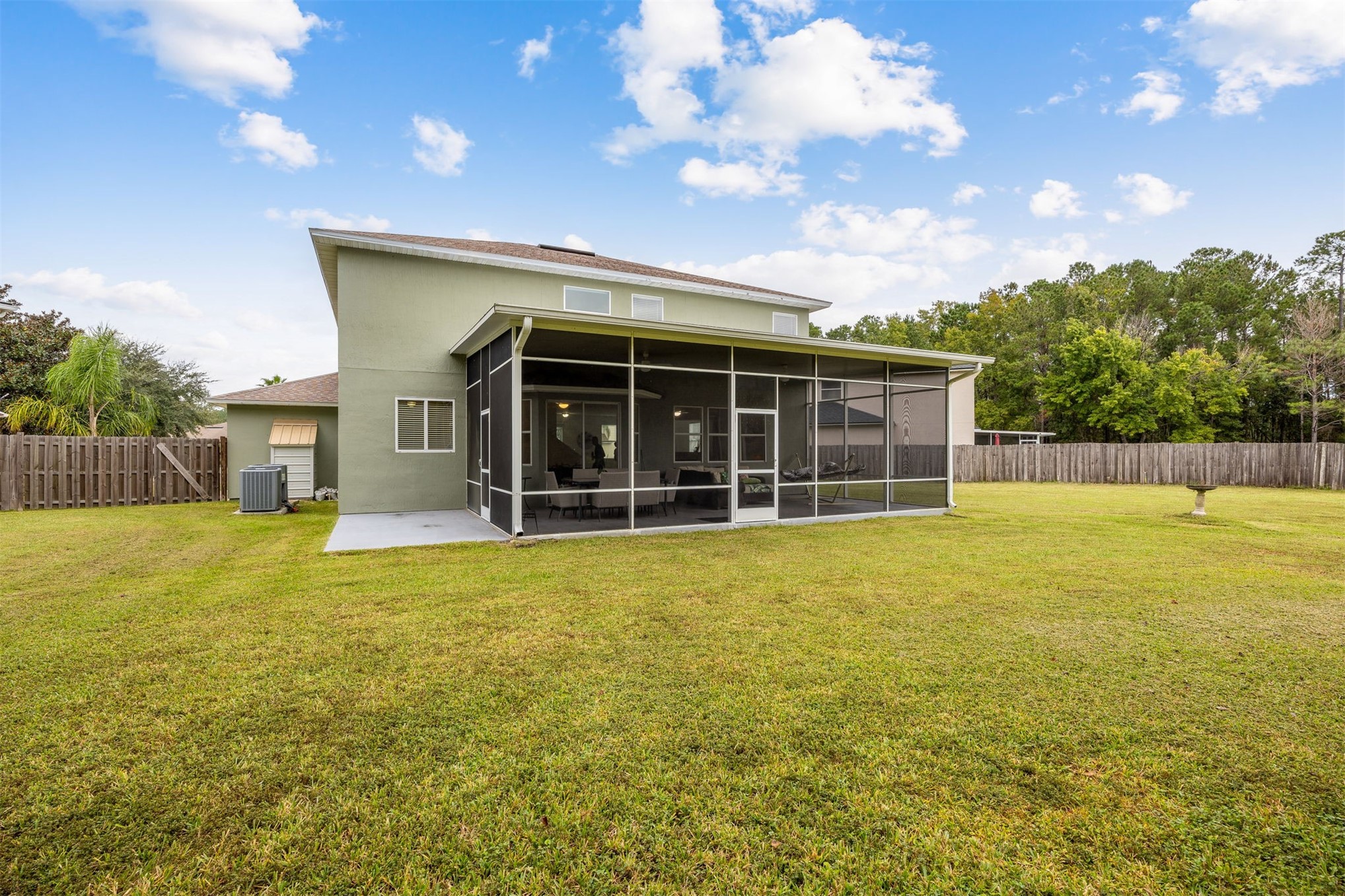 76002 Tideview Lane Yulee, FL 32097 - Photo 40 of 58 a view of a house with a backyard and a tree