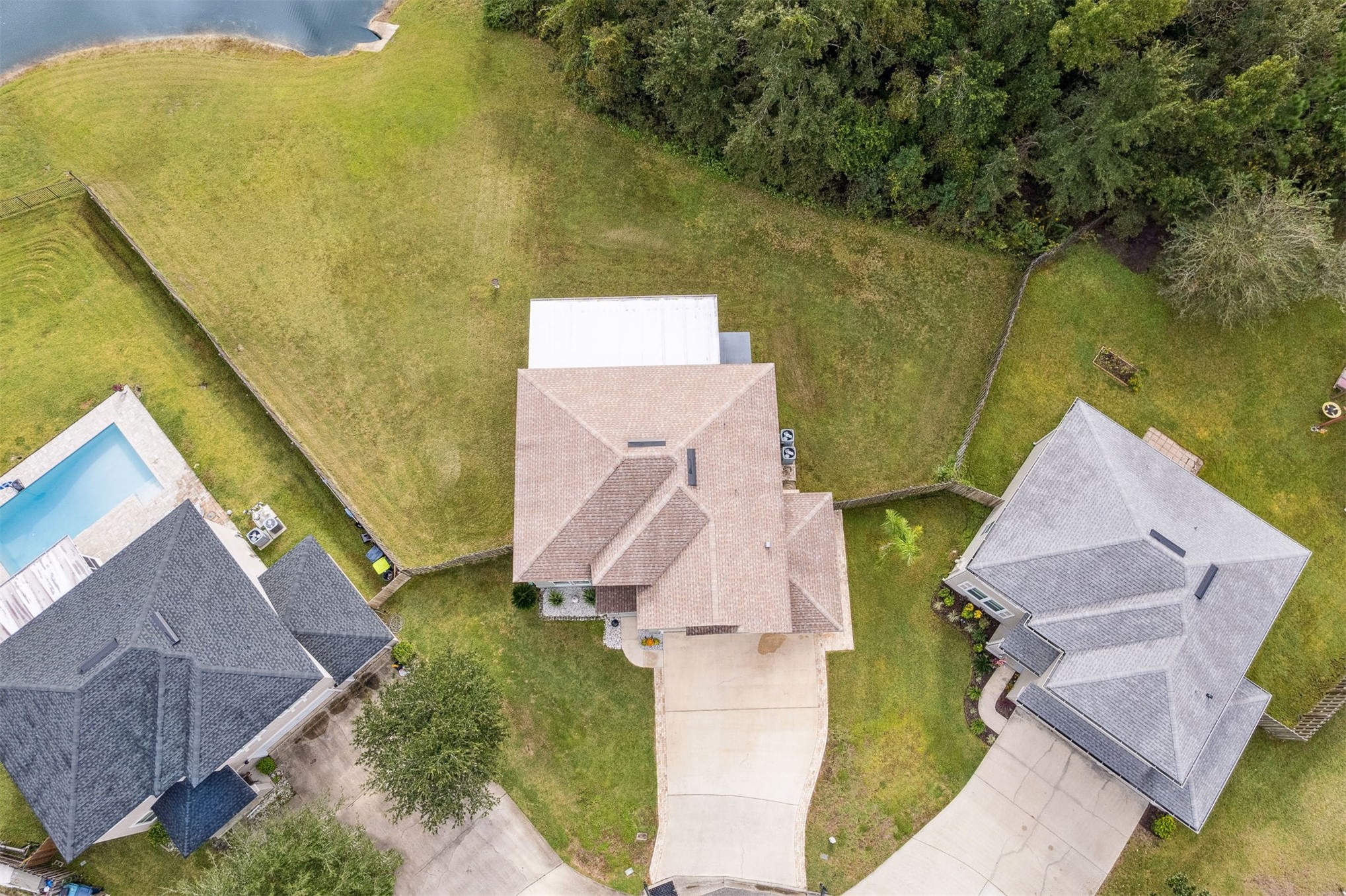 76002 Tideview Lane Yulee, FL 32097 - Photo 45 of 58 an aerial view of a house with a garden and swimming pool