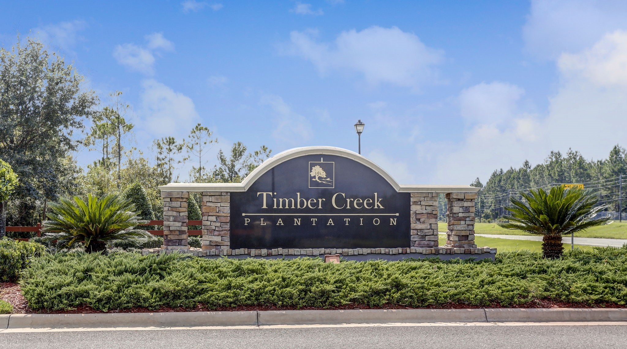 76002 Tideview Lane Yulee, FL 32097 - Photo 50 of 58 a view of a sign board with a small yard