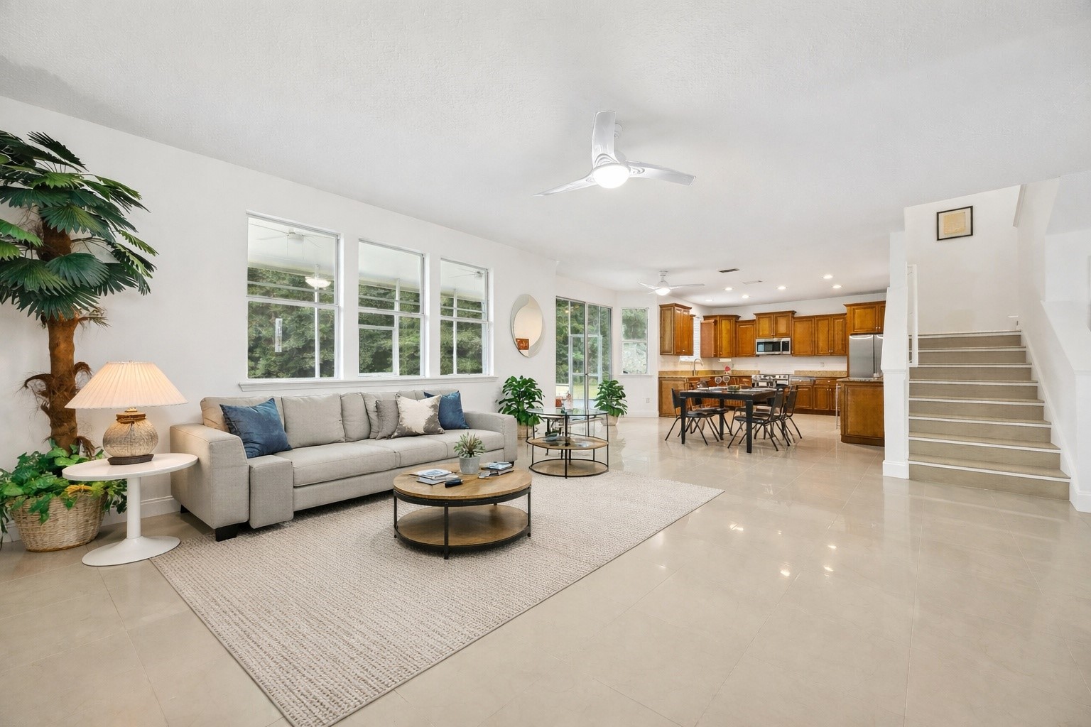 76002 Tideview Lane Yulee, FL 32097 - Photo 9 of 58 a living room with furniture and a large window with garden view