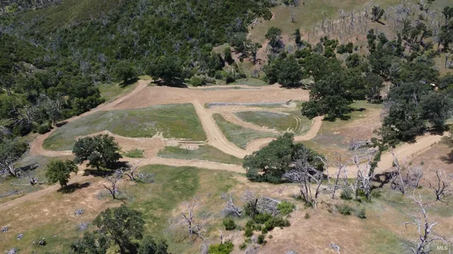 a view of a wooden house with a yard