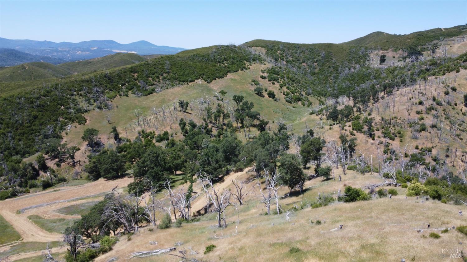 Undisclosed Address Lower Lake, CA 95457 - Photo 18 of 26 a view of a mountain with a field