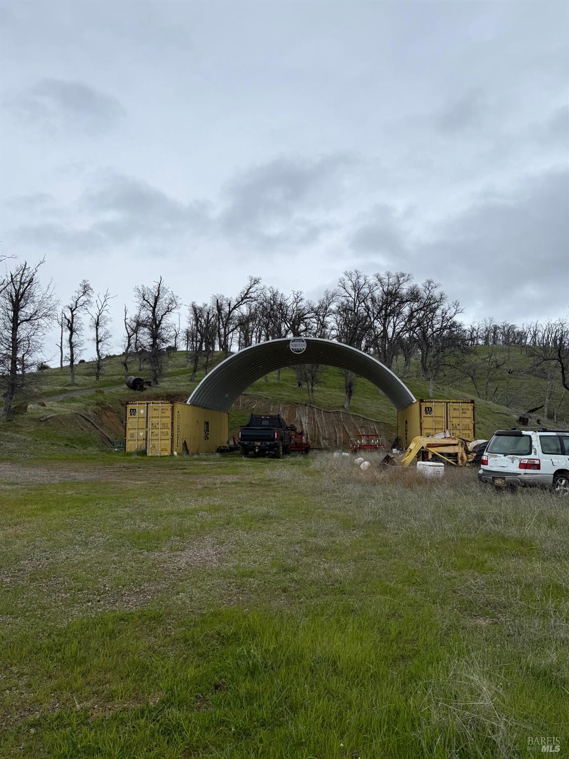Undisclosed Address Lower Lake, CA 95457 - Photo 21 of 26 a view of a big yard with table and chairs under an umbrella