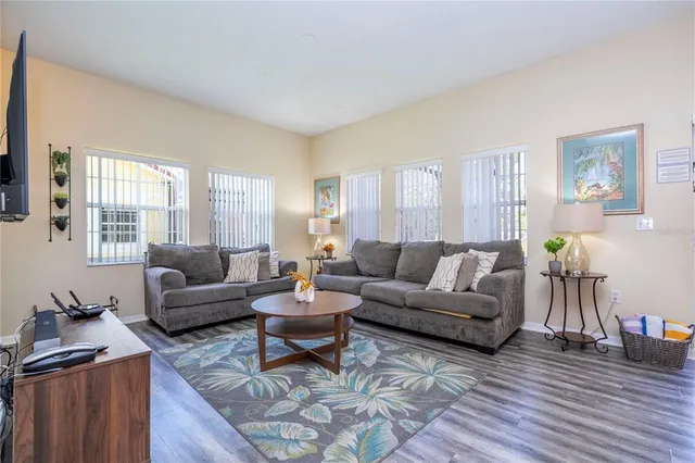a white toilet sitting next to a bath tub