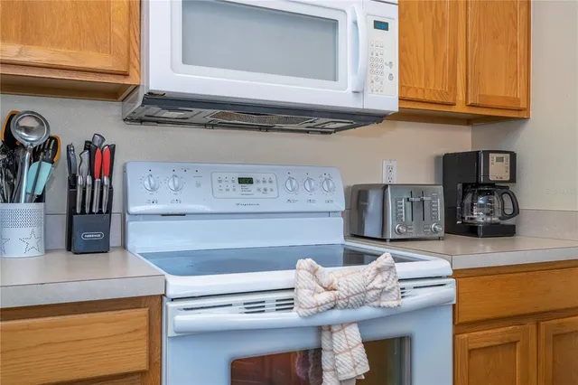 a bedroom with a bed a flat screen tv and a couch