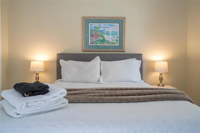 a bedroom with a bed and a closet